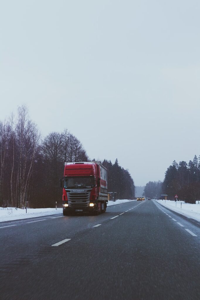 Truck driving on frozen highway
